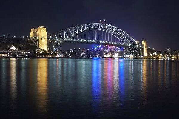 Sydney harbour bridge in Sydney harbour at night
