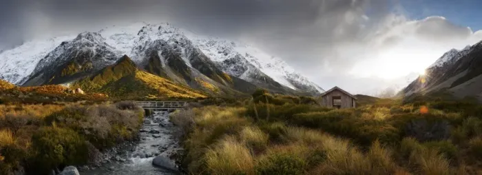 Framed Print : Synshine on snow covered mountains, creek & bridge