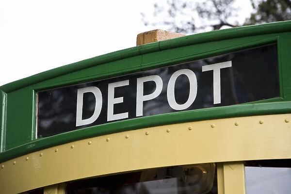 A tram with the word DEPOT written on it