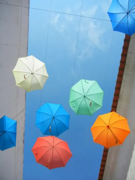 Framed Print : Umbrellas. Artistic installation with umbrellas over street in Evora, Portugal