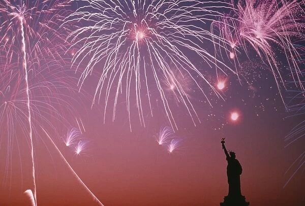 USA, New York City, fireworks on july 4th with silhouette of Statue of Liberty
