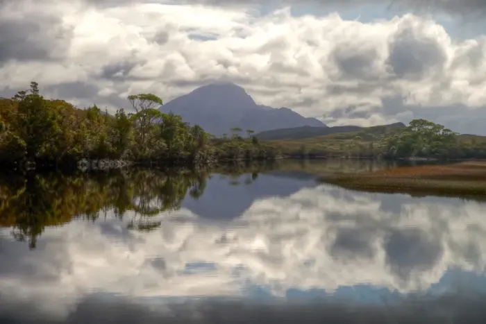 Framed Print : Still water mountain, trees and clouds reflections