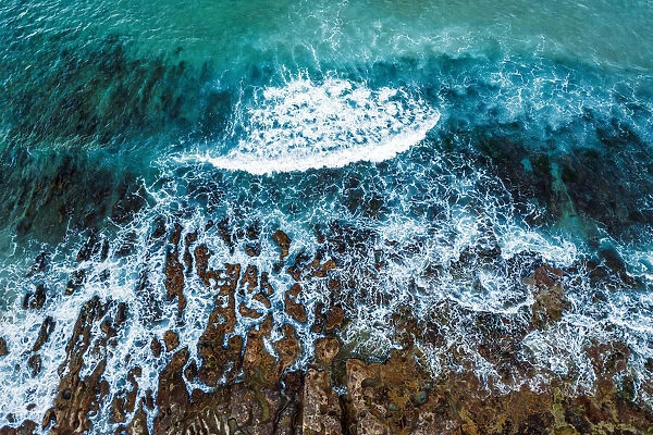 Waves crashing on rocky coast, sea, ocean, aerial view