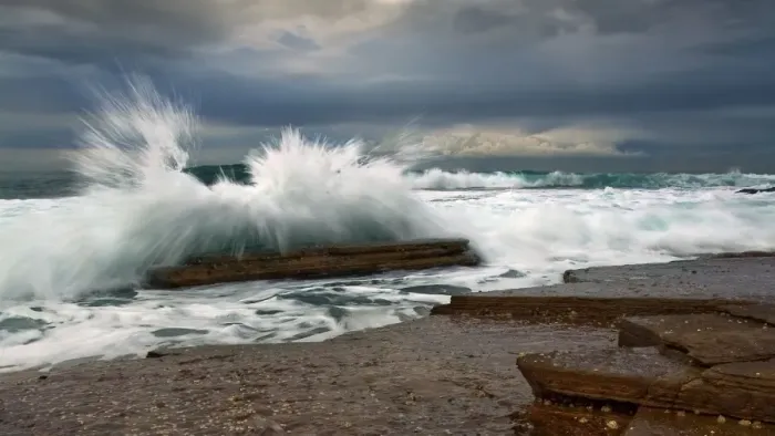 Framed Print : Waves splashing over rock