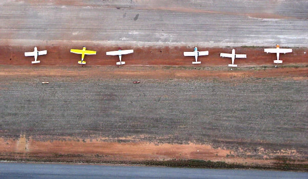 White Planes on Red Dirt Airstrip from Above