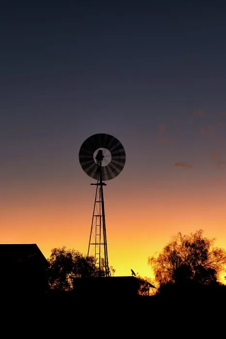 Framed Print : Windmill out in the country at sunset