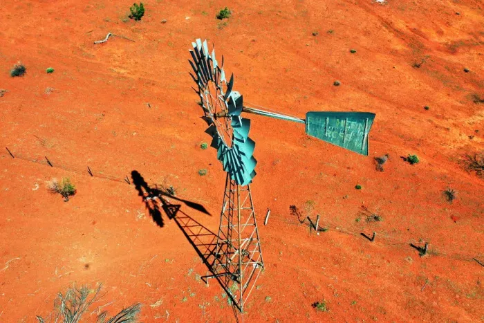 Framed Print : Windmill, water windpump on farm with dry red dirt field, Australia, aerial view Framed Print : Windmill, water windpump on farm with dry red dirt field, Australia, aerial view