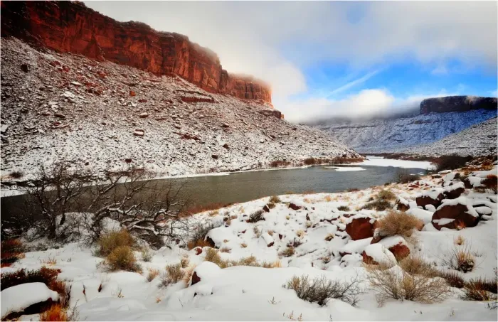 Framed Print : A winter mantle of snow lies along the banks of the Colorado river near Moab in Utah