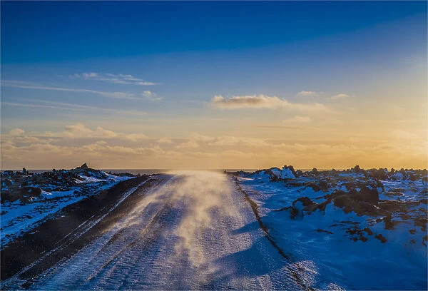 Winter winds blowing across the highway near Arnarstapi, Snaefellness, Iceland