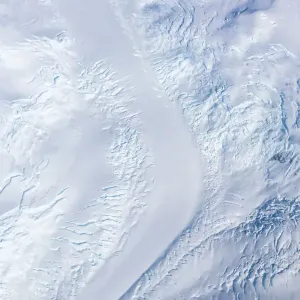Aerial image of a glacier and crevasses, Antarctica