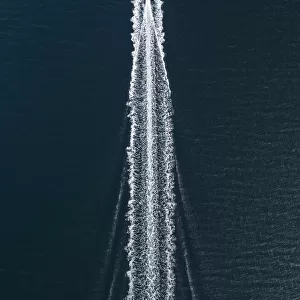 Aerial image of a speed boat moving quickly across the ocean, Hong Kong