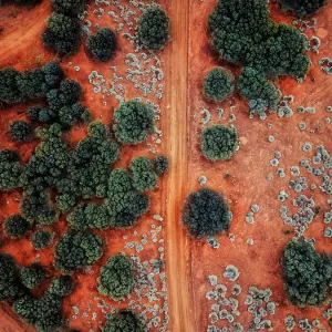 An Aerial shot of the red centre roads in the Australian Outback