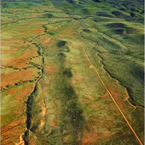 An Aerial view of the Australian outback in the Flinders Ranges, showing the vibrant colours of the Landscape