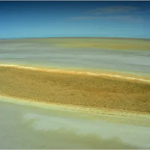An Aerial view of the Australian outback in flood around Lake Eyre, showing the vibrant colours of the Landscape