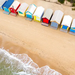 Aerial view of the Brightly Colored Beach Houses on the sand