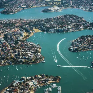 aerial view of cityscape in Sydney, buildings and river, lake, bay