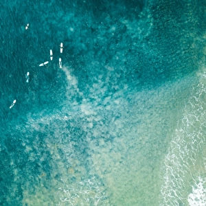 Aerial view of surfers on the ocean