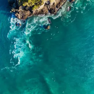 Aerial View Of Surfers At Piha Beach, Auckland, New Zealand Aerial View Of Surfers At Piha Beach, Auckland, New Zealand