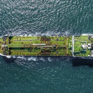 Aerial view tanker ship anchor parking in sea, Crude oil tanker ship and LPG tanker ship loading in bay at sunset, Bulk boat anchor