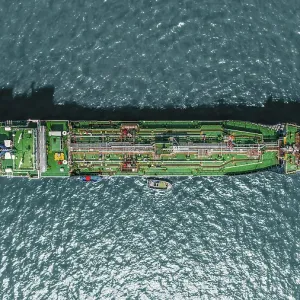 Aerial view tanker ship anchor parking in sea, Crude oil tanker ship and LPG tanker ship loading in bay at sunset, Bulk boat anchor