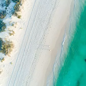Aerial views over coastal beach scene in summer