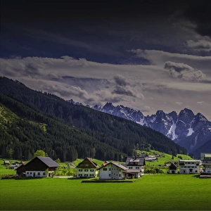 Alpine meadows and traditional buildings near Hallstatt, in the mountainous region of Salzkammergut, Austria