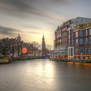 Amstel river and Munttoren Amsterdam sunset view