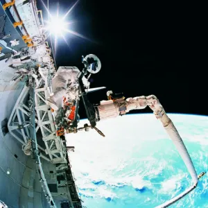 An astronaut working in space An astronaut working in space