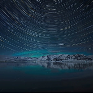 Aurora Borealis and star-trails at Jokulsarlon lagoon in winter, southern Iceland