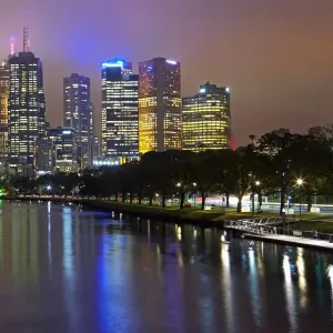 Australia, Melbourne, Yarra river and cityscape illuminated at dusk Australia, Melbourne, Yarra river and cityscape illuminated at dusk