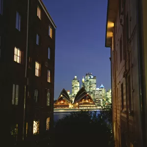 Australia, Sydney, view of opera house between apartment buildings