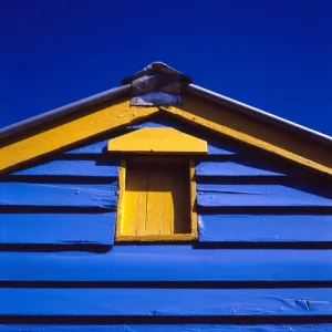 Blue and yellow painted building under blue sky