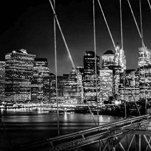 Brooklyn Bridge and Mahanttan skyline at night in black and white