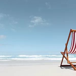 Canvas deck chair on a beach. Australia
