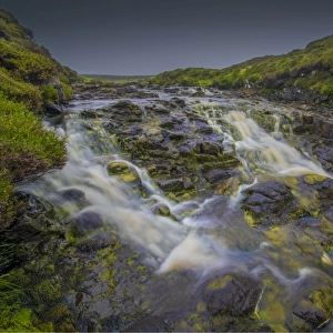 Cascading water in the mountainous region of the Cuillins, Isle of Skye, Scotland, the United Kingdom