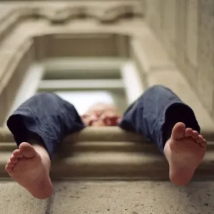 child sitting in window