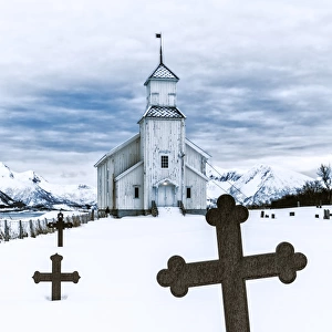 Church in GimsA┼¥y with graveyard during winter time