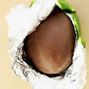 Close-up of an unwrapped chocolate Easter egg