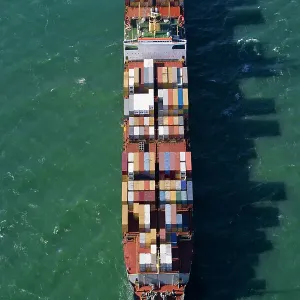 Container ship at sea, aerial view