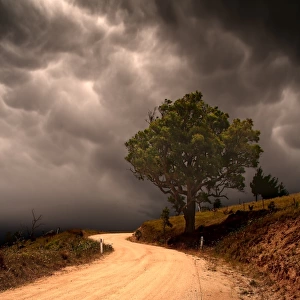 Country Road Against Dark Clouds