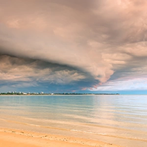 Darwin city under storm cloud