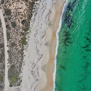 Dirt road to a nice sandy beach - Aerial view