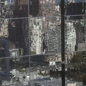 Distorted reflections of city skyscraper in Melbourne, Victoria, Australia Distorted reflections of city skyscraper in Melbourne, Victoria, Australia