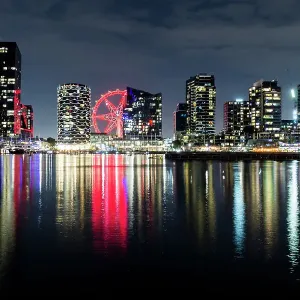 Docklands city skyline and Melbourne Star Observation Wheel illuminated at night Docklands city skyline and Melbourne Star Observation Wheel illuminated at night