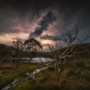 Dramatic storm clouds pass over the landscape in the Kosciuszko National Park