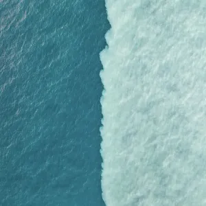 Drone image looking down on a water confluence in the Indian Ocean, Broome, Western Australia, Australia Drone image looking down on a water confluence in the Indian Ocean, Broome, Western Australia, Australia