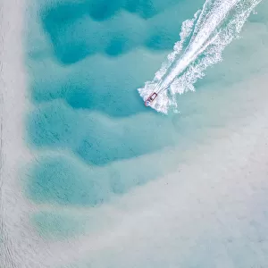 Drone photograph of a motorboat on the Noosa river, Australia