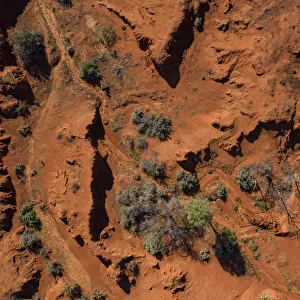 Drone point of view over the red earth of the Australian Outback