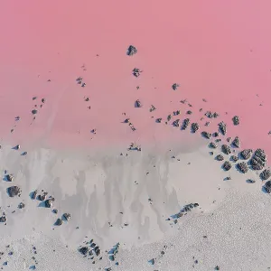 Drone view point of the pink shades of color, patterns and textures over Pink Lake waters with dark salty sandy soil Drone view point of the pink shades of color, patterns and textures over Pink Lake waters with dark salty sandy soil