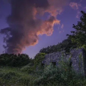 Dusk over ruins in the village of Pembroke, Pembrokeshire, Wales, United Kingdom